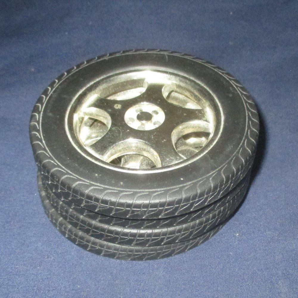 A lot of 4 Racing Tires Drink Coasters